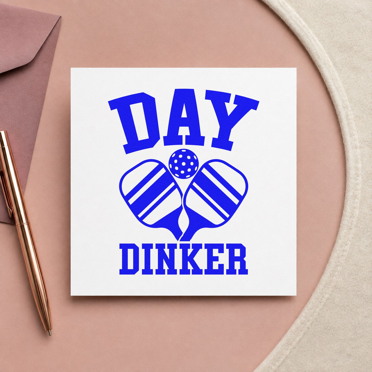 Day Dinker Crossed Paddles craft stamp imprinted in blue ink on paper, a design suited to framed park office.