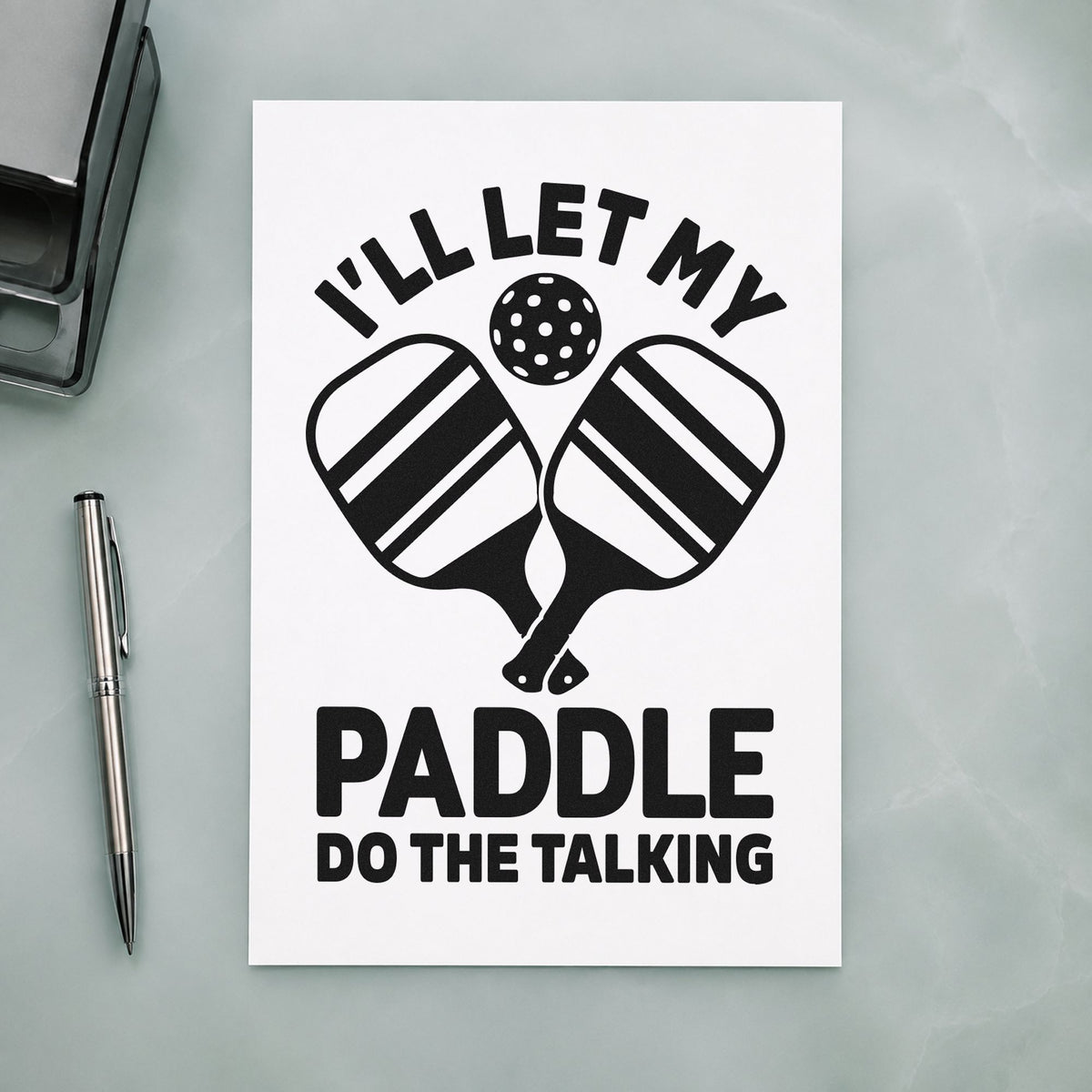 Let Paddle Do Talking craft stamp imprint in black ink on a handmade project, one idea being finished paddle tags.