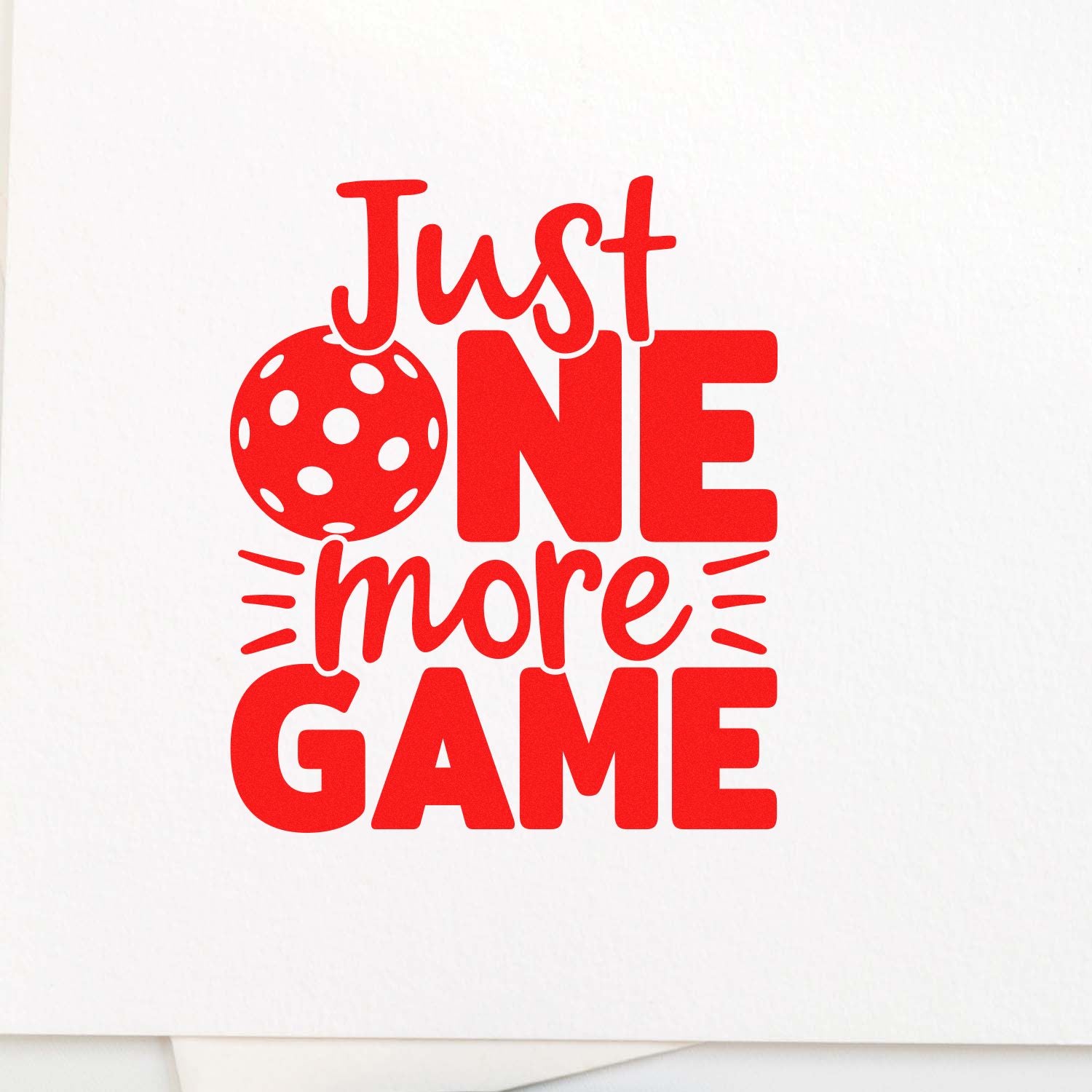 Pickleball rubber stamp design with Just One More Game text, ideal for sports-themed cards, crafts, and team gifts.