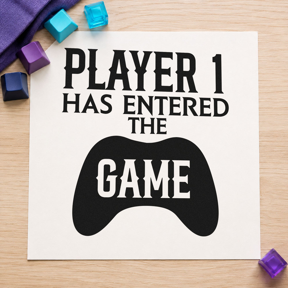Player One Entered Game craft stamp imprint in black ink on a handmade project, one idea being baby gift tags.