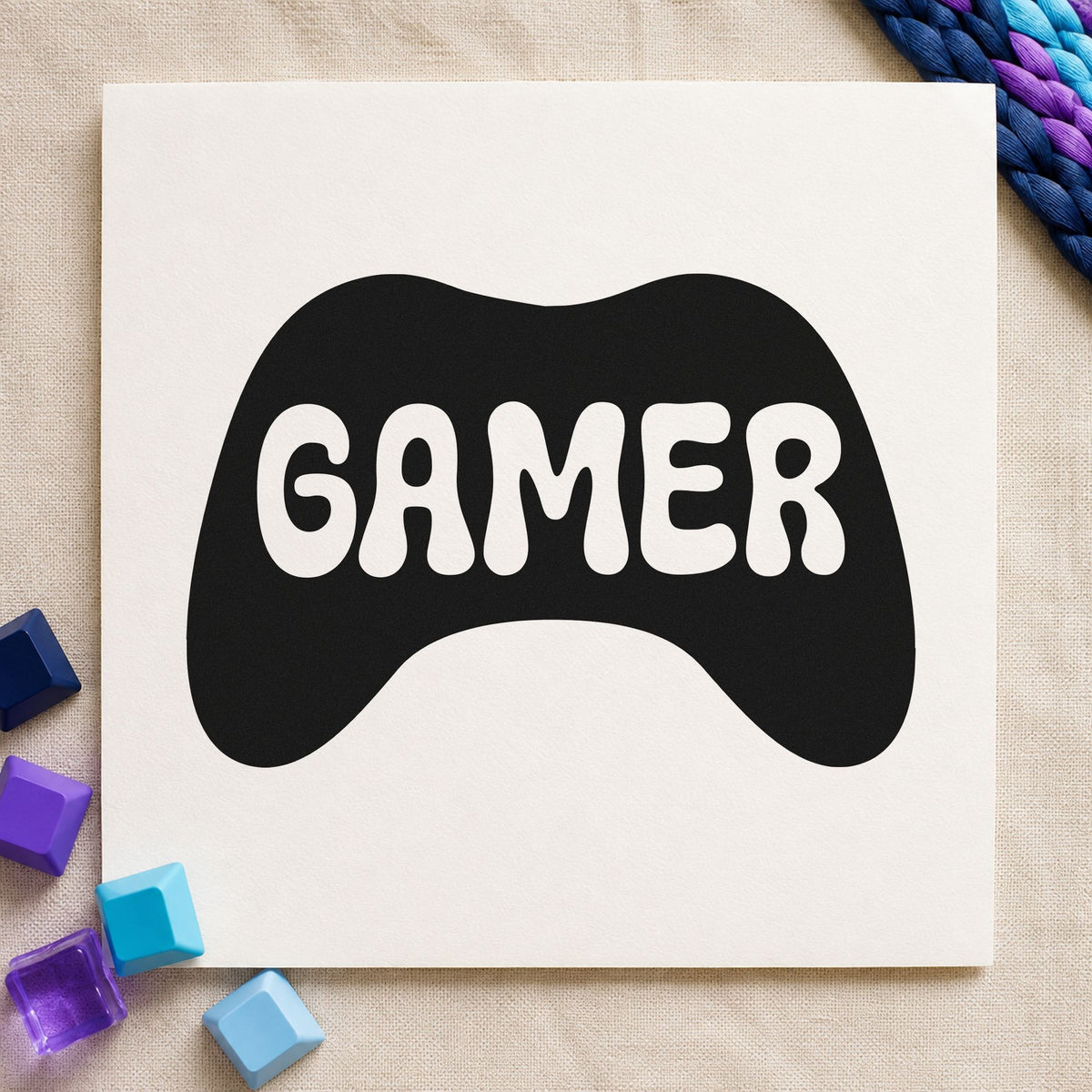 Gamer Controller Silhouette Graphic craft stamp imprint in black ink on a handmade project, one idea being part box gift tags.