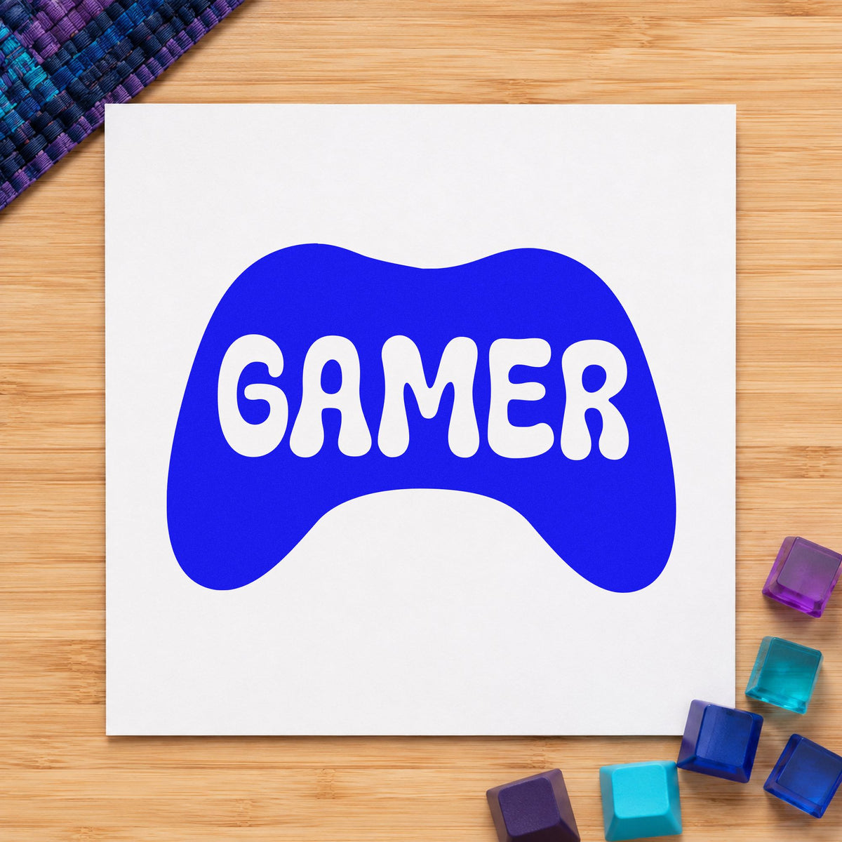 Gamer Controller Silhouette Graphic craft stamp in blue ink on cardstock, an easy option for desk mat printing.