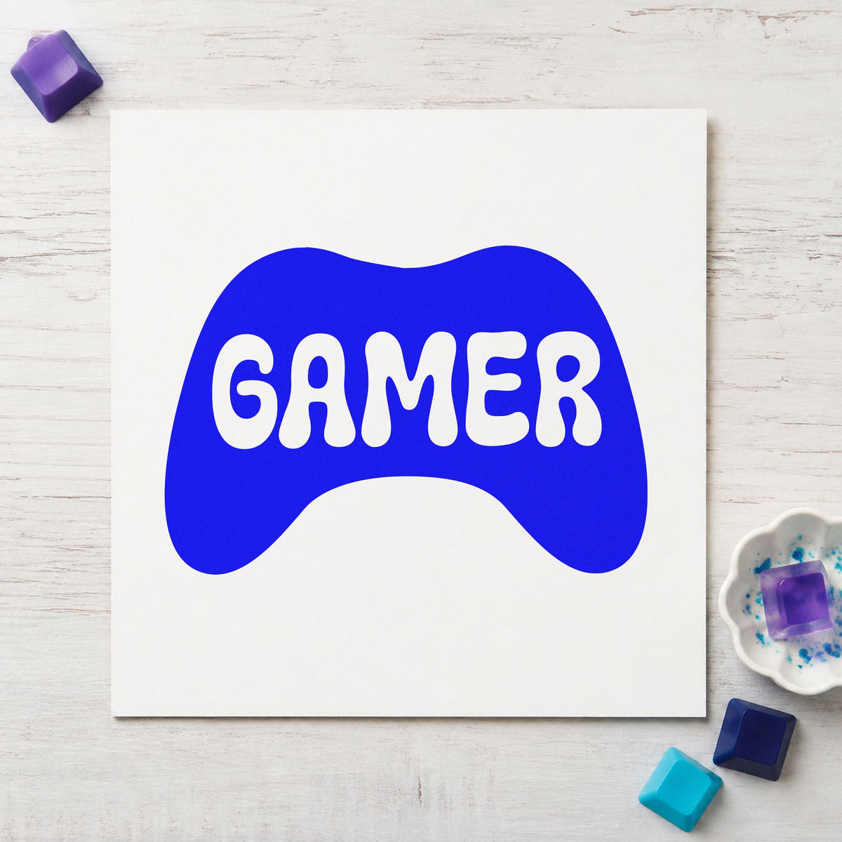 Gamer Controller Silhouette Graphic craft stamp imprinted in blue ink on paper, a design suited to framed desk wall.