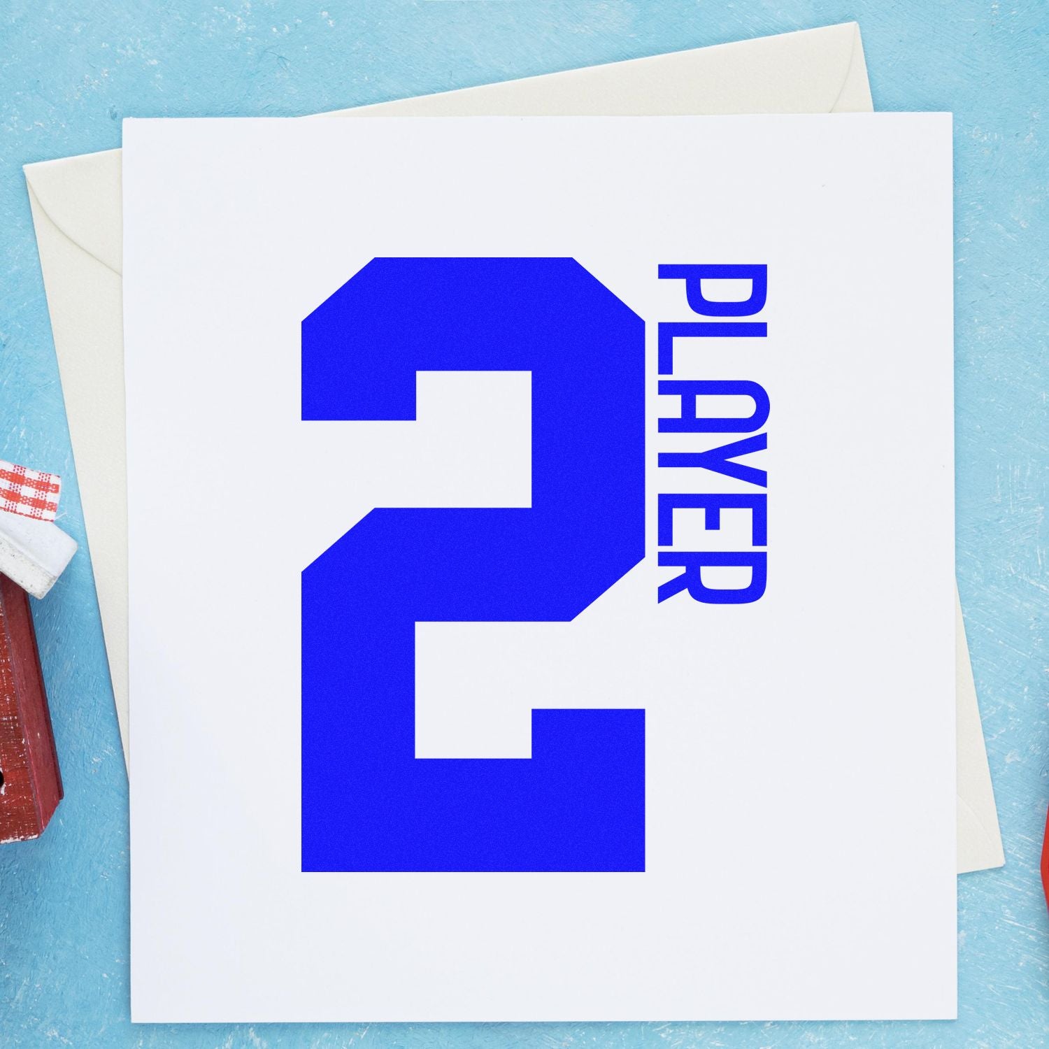 Custom blue number 2 player rubber stamp design on a greeting card and envelope