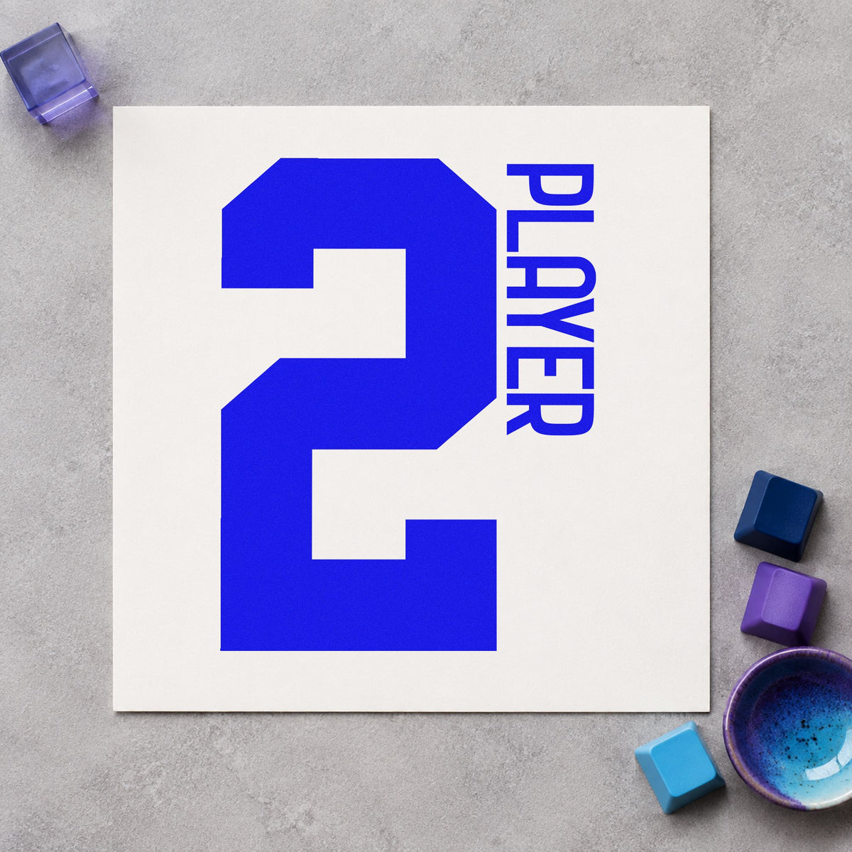Player Two Bold Number craft stamp in blue ink on cardstock, an easy option for sofa throw printing.