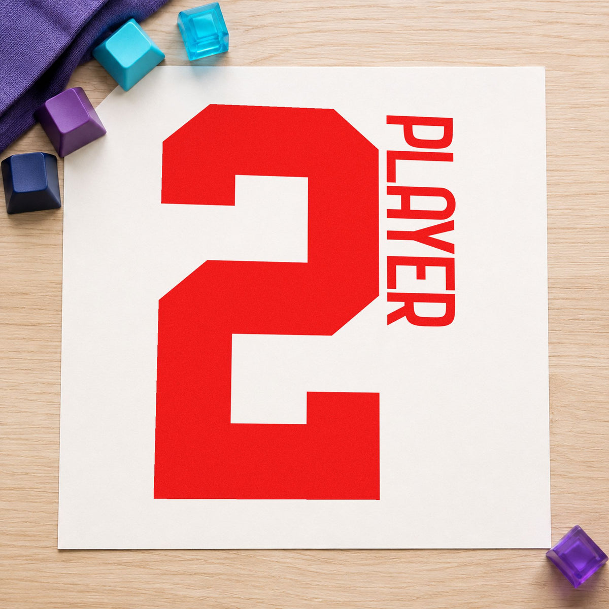 Player Two Bold Number craft stamp imprint in red ink on a handmade project, one idea being session log cards.