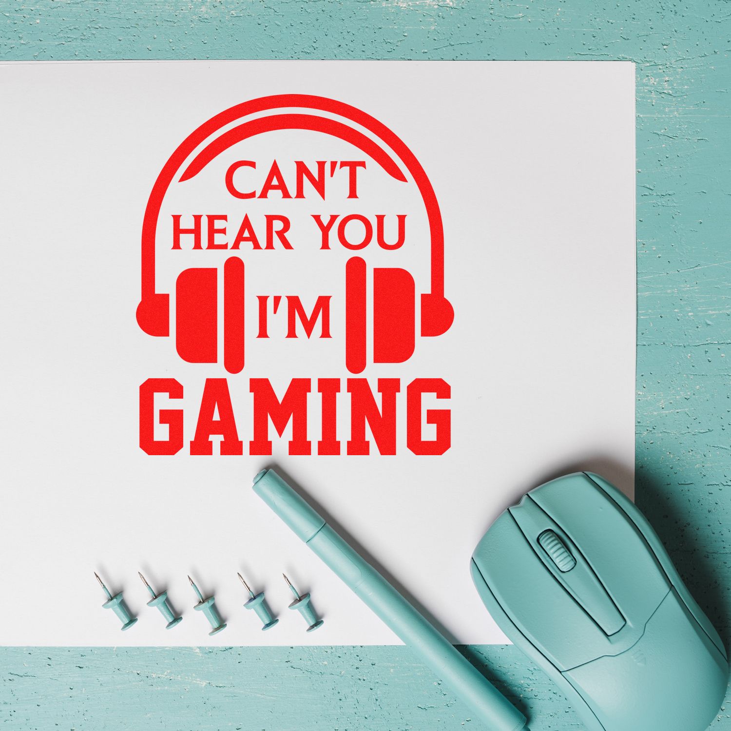 Custom gamer rubber stamp design with headset icon and Cant Hear You, Im Gaming text on a white sheet.