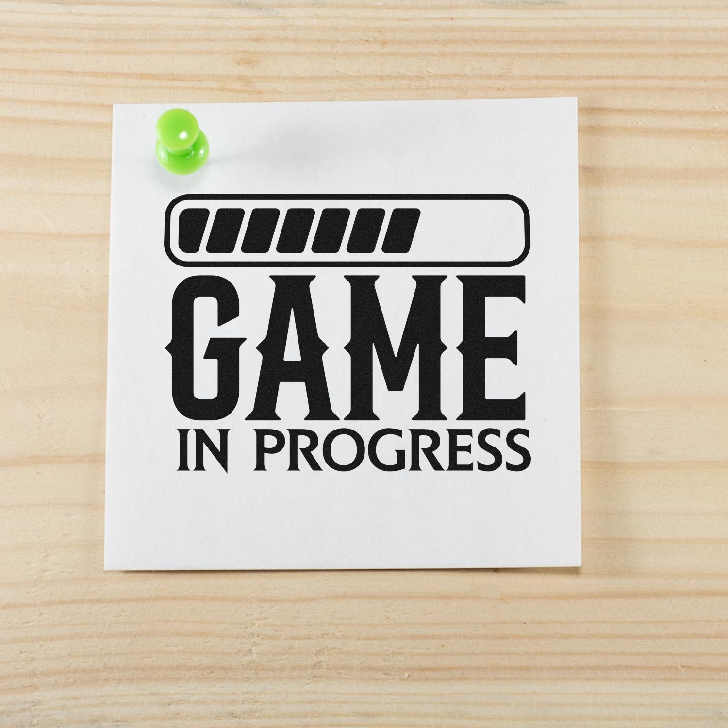 Game in Progress rubber stamp design with progress bar on pinned paper for gaming project updates