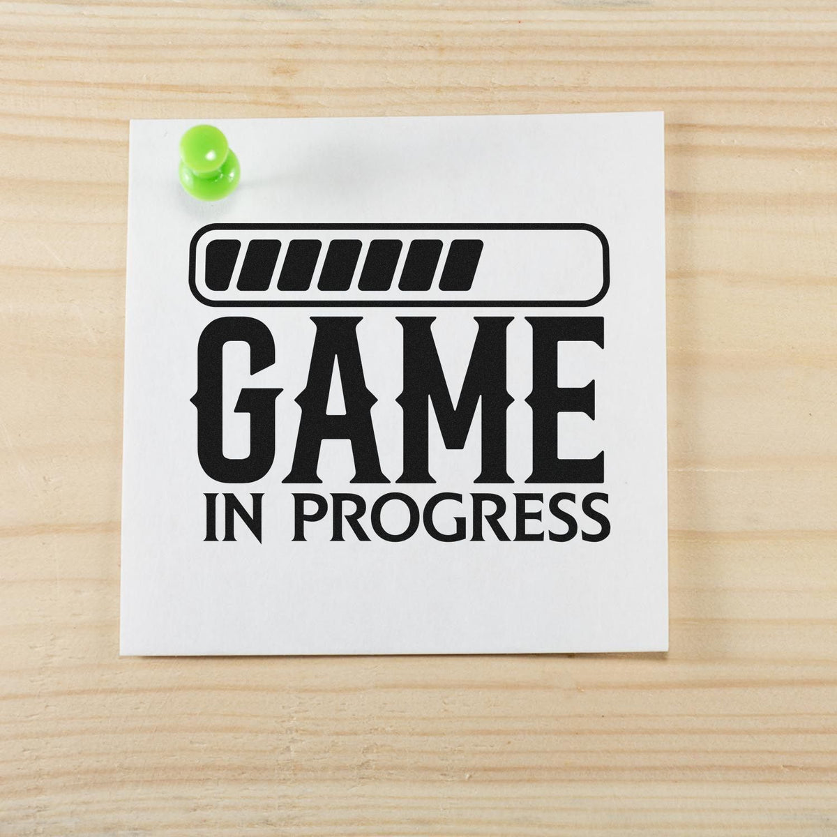 Vintage Pro Game In Progress Loading Premium Wooden Stamp imprint stamped in black ink. A partly filled loading bar sits above GAME IN PROGRESS.