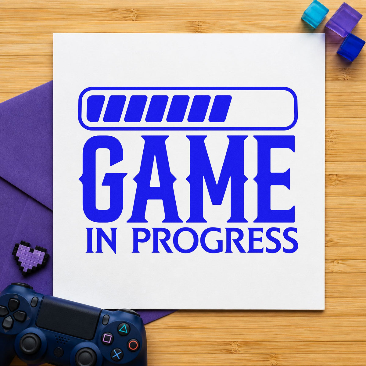Game In Progress Loading craft stamp in blue ink on cardstock, an easy option for table cloth printing.