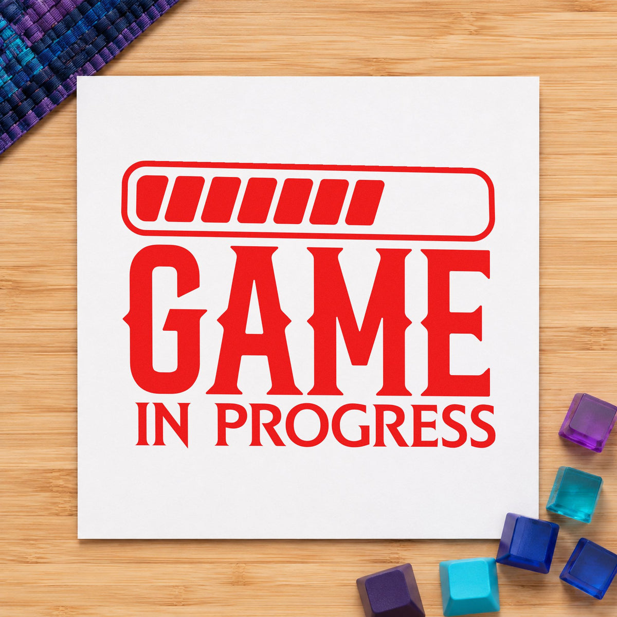 Game In Progress Loading craft stamp imprint in red ink on a handmade project, one idea being bracket slip cards.