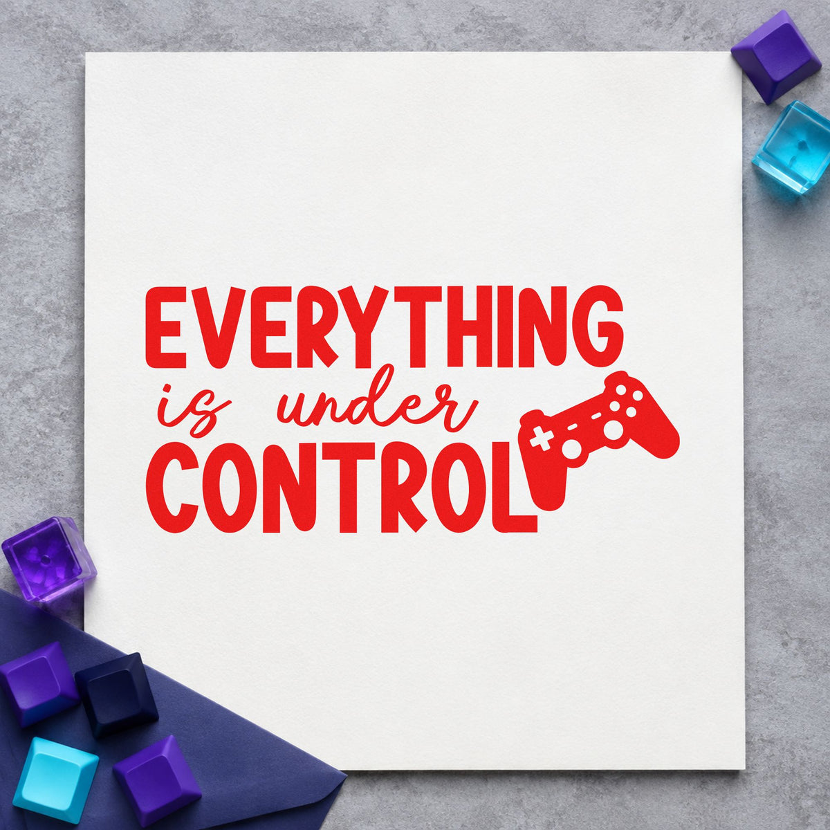 Everything Is Under Control craft stamp imprint in red ink on a handmade project, one idea being game pick cards.