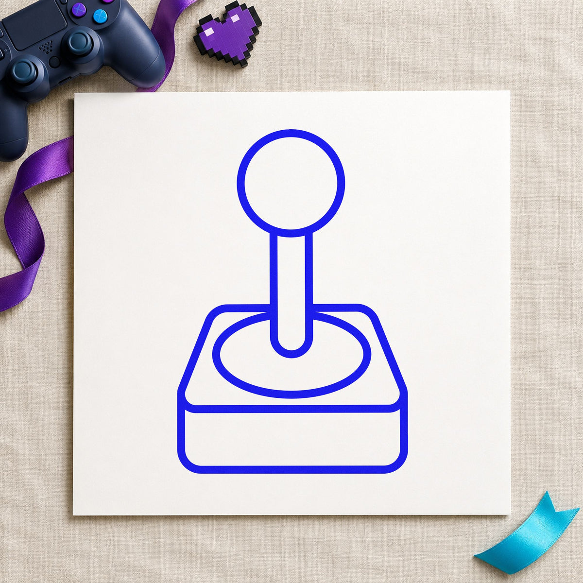 Retro Joystick Outline Graphic craft stamp imprinted in blue ink on paper, a design suited to framed work shop.