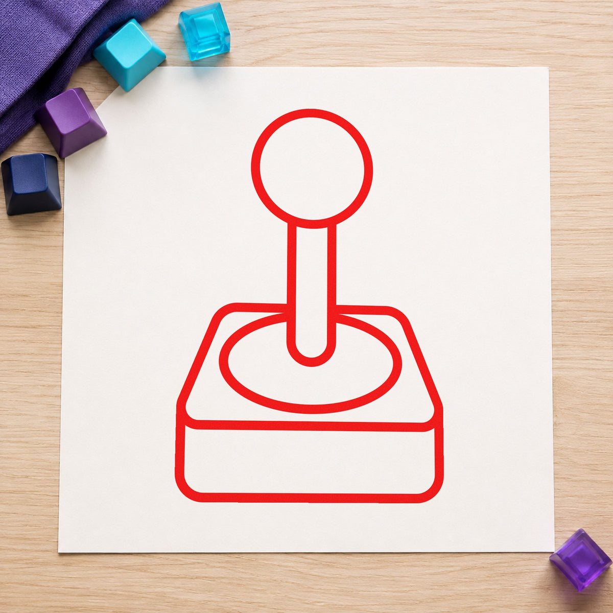 Retro Joystick Outline Graphic craft stamp imprint in red ink on a handmade project, one idea being progress log cards.