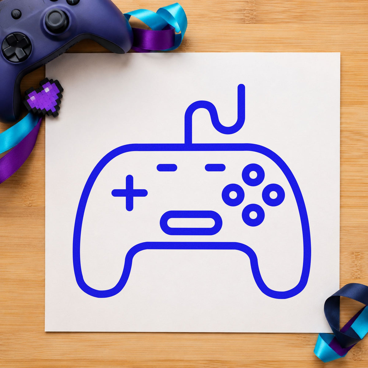 Outlined Wired Game Controller craft stamp imprinted in blue ink on paper, a design suited to framed display shelf.