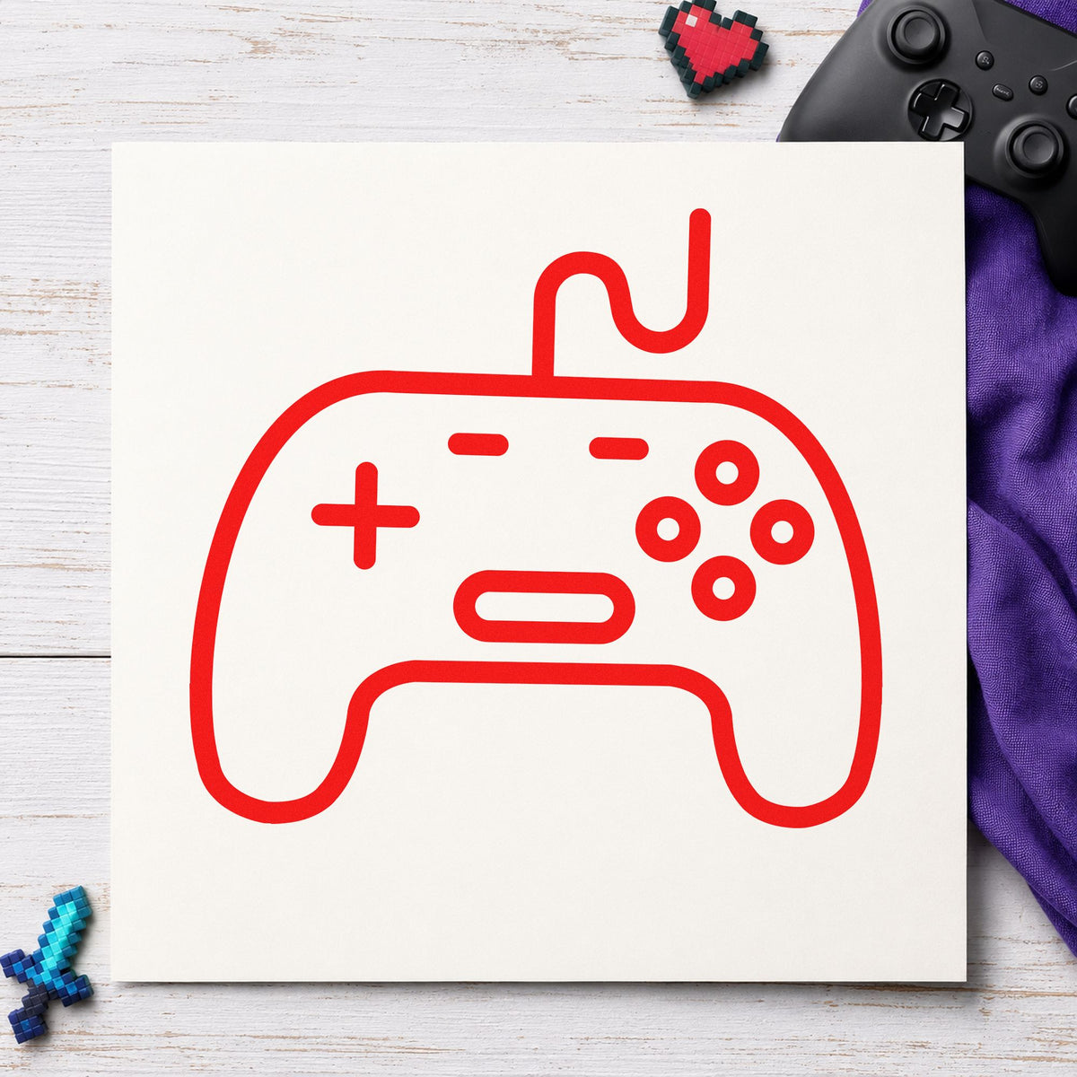 Outlined Wired Game Controller craft stamp imprint in red ink on a handmade project, one idea being trade note cards.