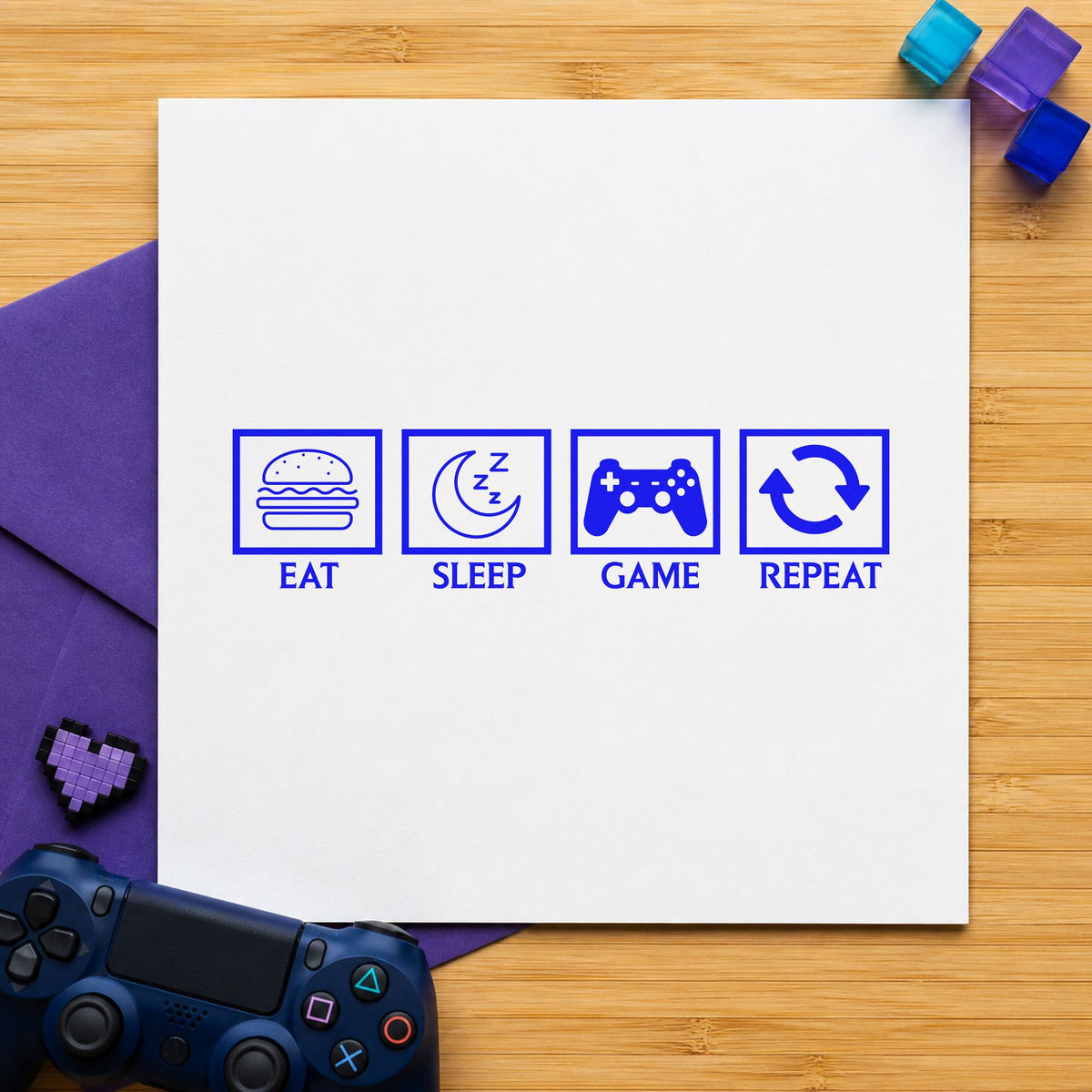 Eat Sleep Game Repeat craft stamp in blue ink on cardstock, an easy option for duvet corner printing.