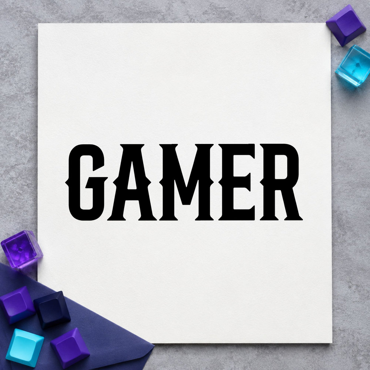 Gamer Bold Slab Lettering craft stamp imprint in black ink on a handmade project, one idea being order bag gift tags.