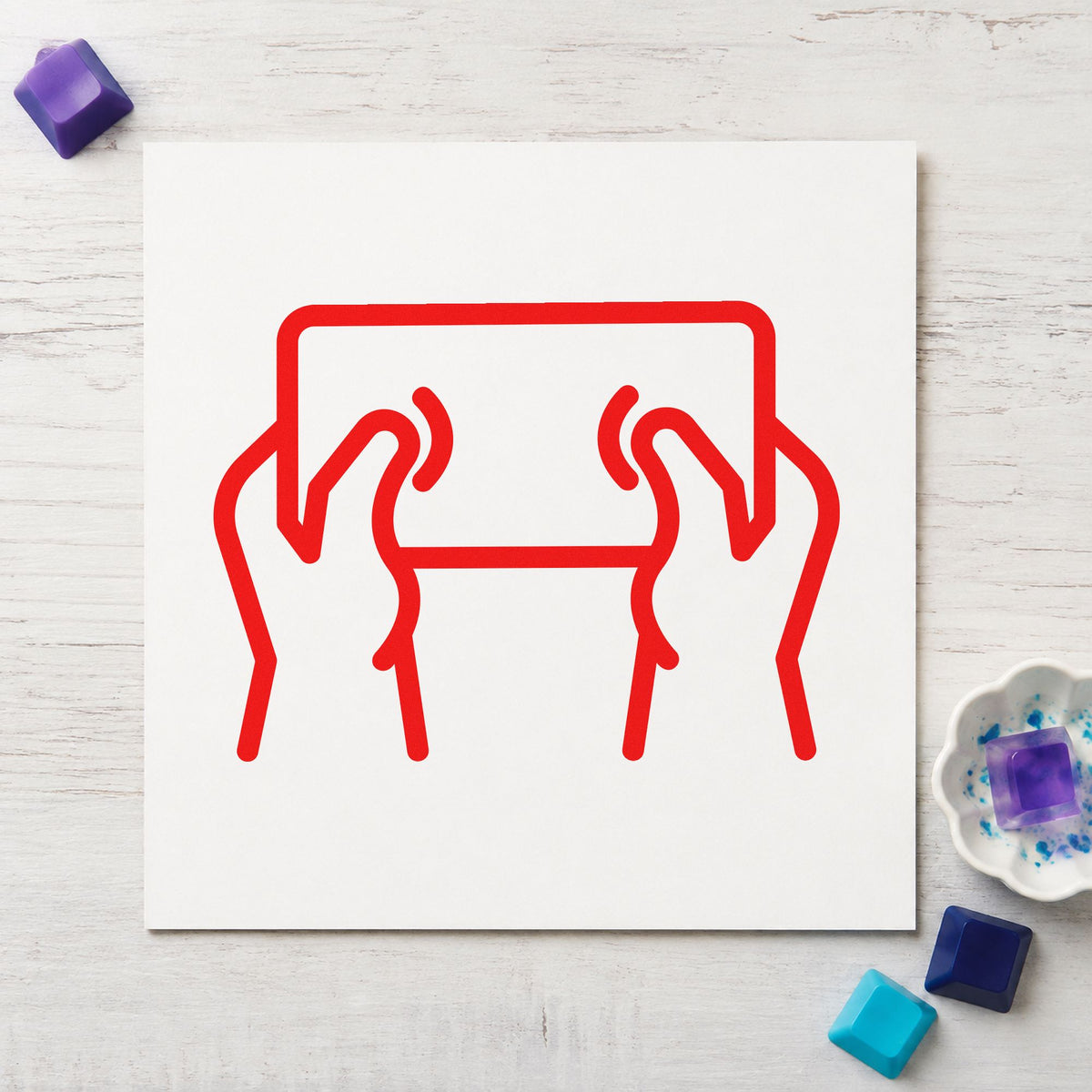 Hands Holding Outlined Tablet rubber stamp shown in red ink, stamped for projects such as bin device labels.