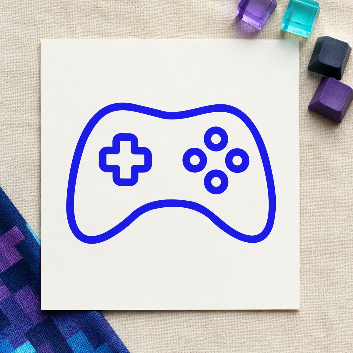 Simple Outlined Game Controller craft stamp in blue ink on cardstock, an easy option for table cover printing.