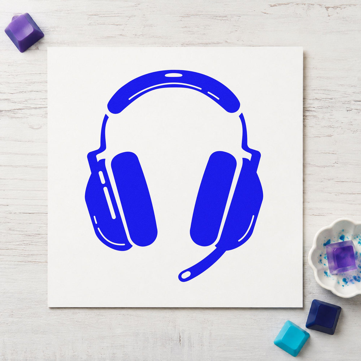 Gaming Headset With Microphone craft stamp imprinted in blue ink on paper, a design suited to framed practice room.