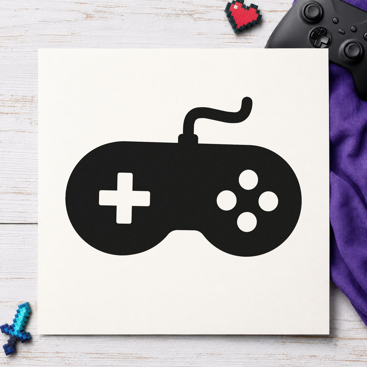 Solid Wired Retro Controller craft stamp imprint in black ink on a handmade project, one idea being loan case gift tags.
