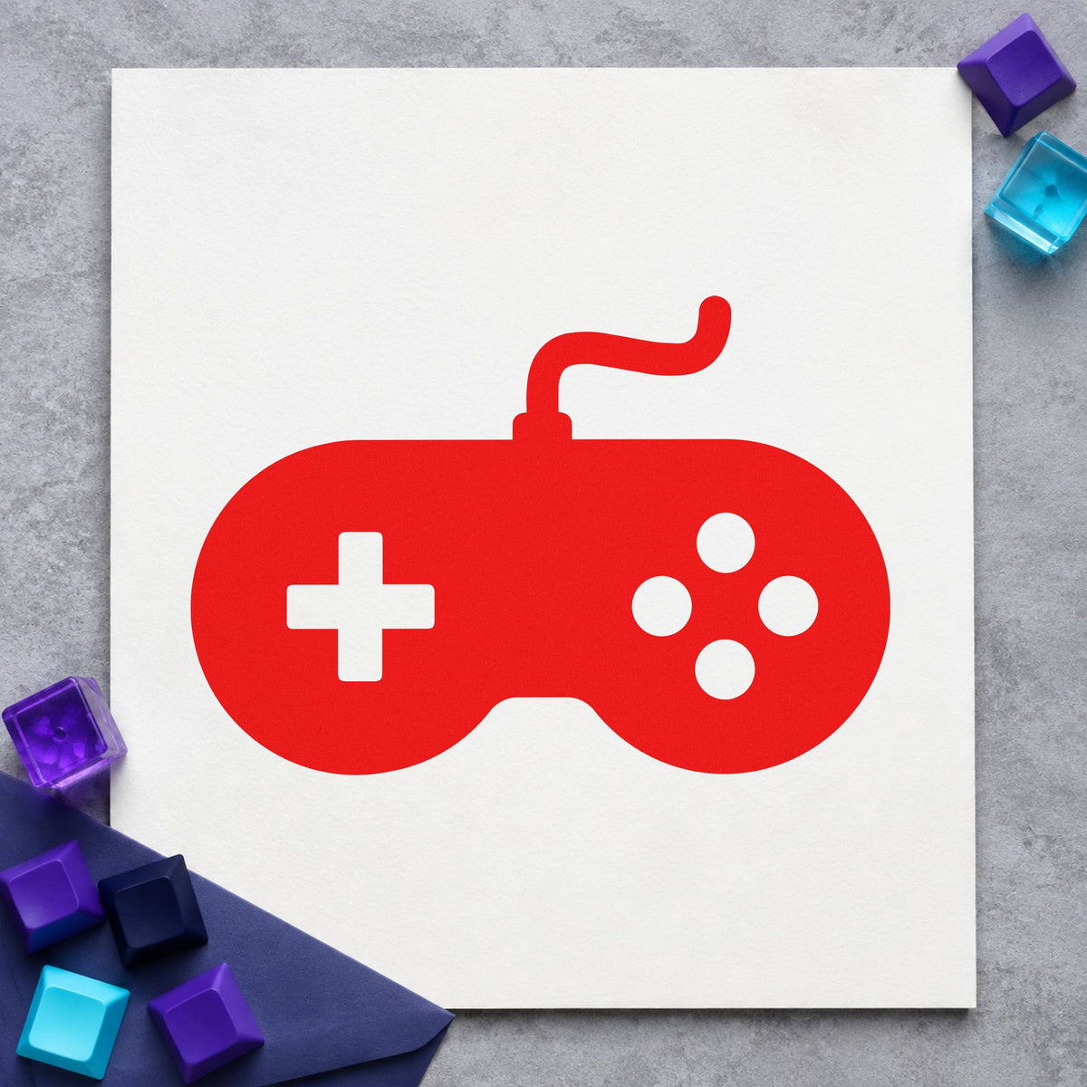 Solid Wired Retro Controller craft stamp imprint in red ink on a handmade project, one idea being loan slip cards.