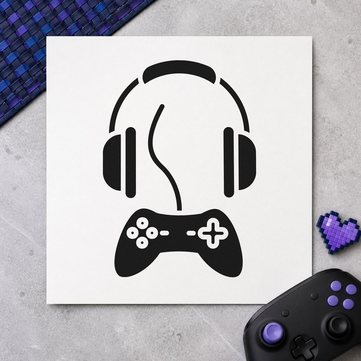 Headphones Above Wired Controller craft stamp imprint in black ink on a handmade project, one idea being guest gift tags.