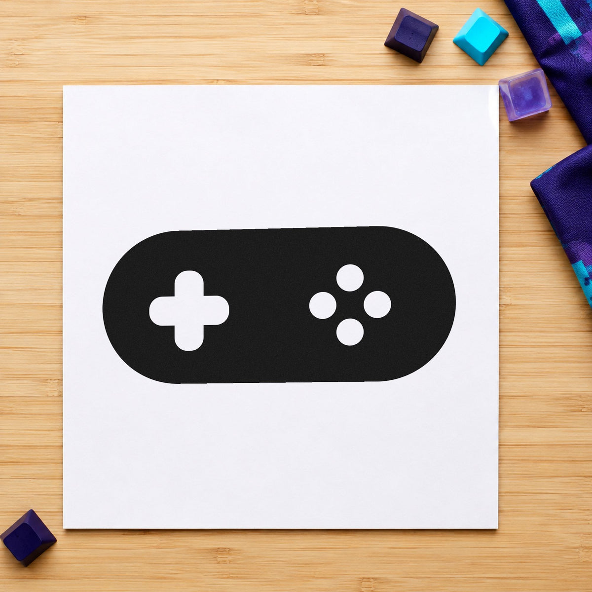 Rounded Retro Game Controller craft stamp imprint in black ink on a handmade project, one idea being token cup gift tags.