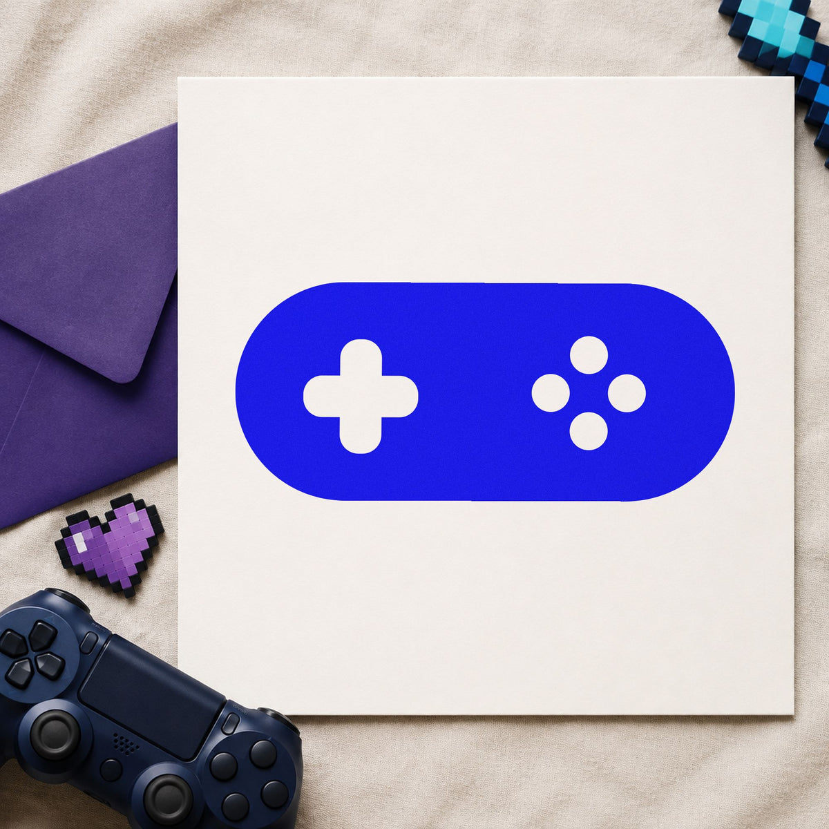 Rounded Retro Game Controller craft stamp in blue ink on cardstock, an easy option for bar towel printing.