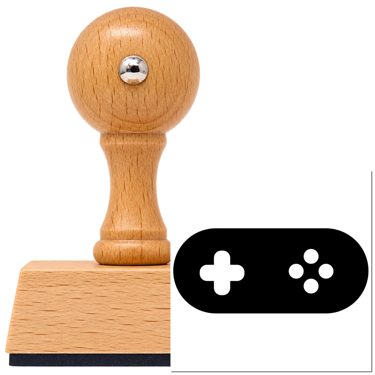 Pill-Shaped Controller Button Silhouette Vintage Pro rubber stamp in European beech wood with a round knob handle, shown beside its black imprint.