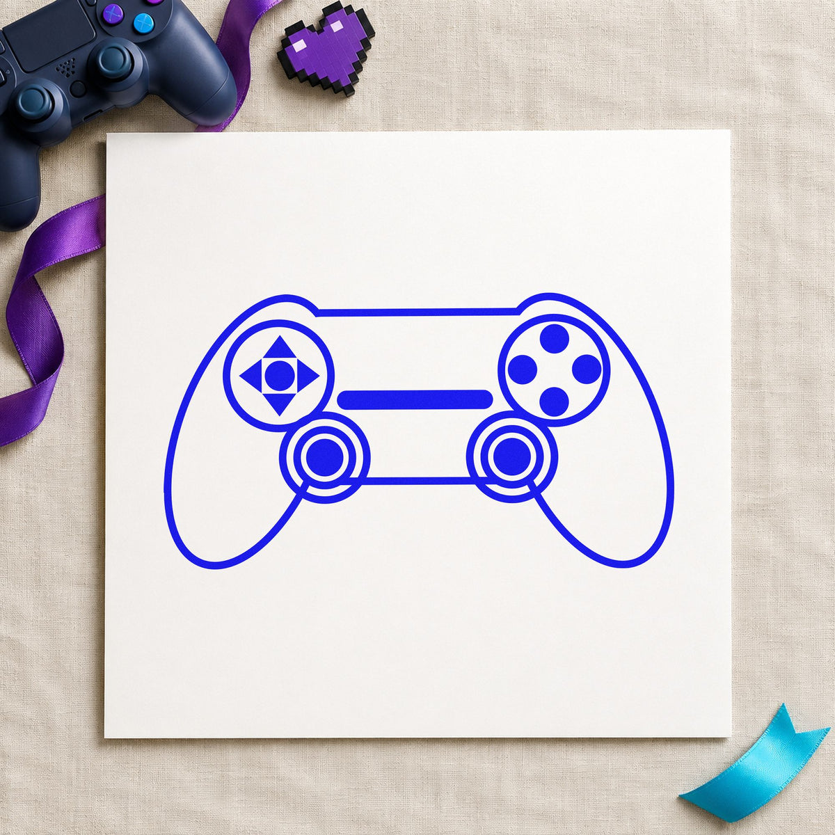 Outlined Dual Stick Controller craft stamp in blue ink on cardstock, an easy option for laptop sleeve printing.