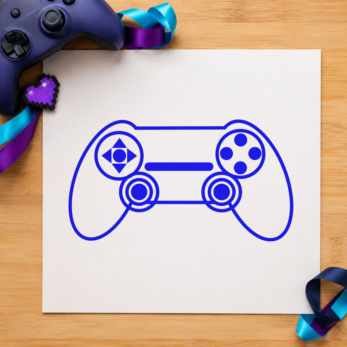 Outlined Dual Stick Controller craft stamp imprinted in blue ink on paper, a design suited to framed studio desk.