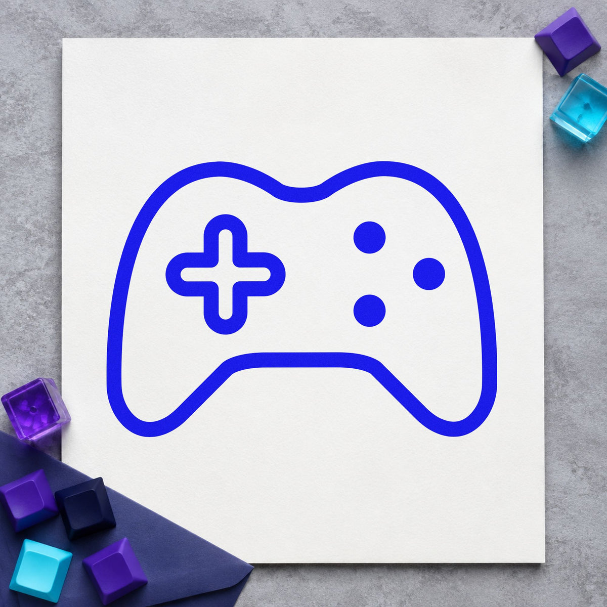 Three Button Controller Outline craft stamp in blue ink on cardstock, an easy option for console cover printing.