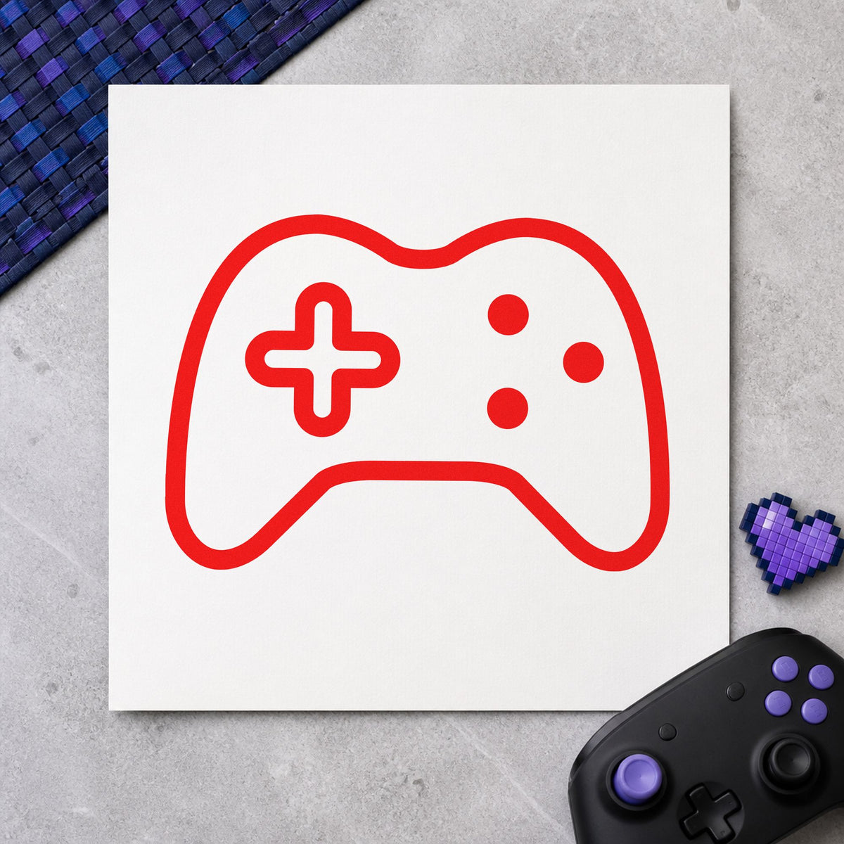 Three Button Controller Outline craft stamp imprint in red ink on a handmade project, one idea being play rule cards.