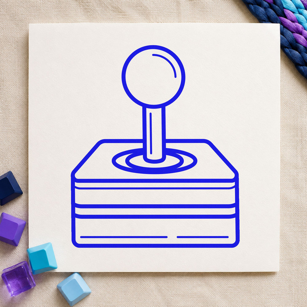 Retro Joystick Layered Base craft stamp imprinted in blue ink on paper, a design suited to framed rig corner.