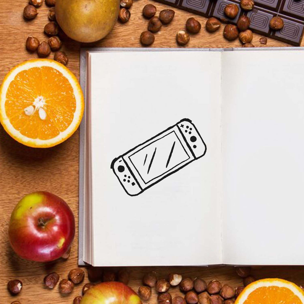 Wide-Screen Handheld Game Console Stamp - Premium Vintage Pro Wooden imprint stamped in black ink. A tilted handheld console has a wide screen and buttons at both ends.