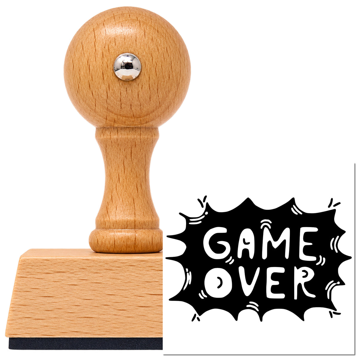 Game Over Comic Burst Lettering Vintage Pro rubber stamp in European beech wood with a round knob handle, shown beside its black imprint.