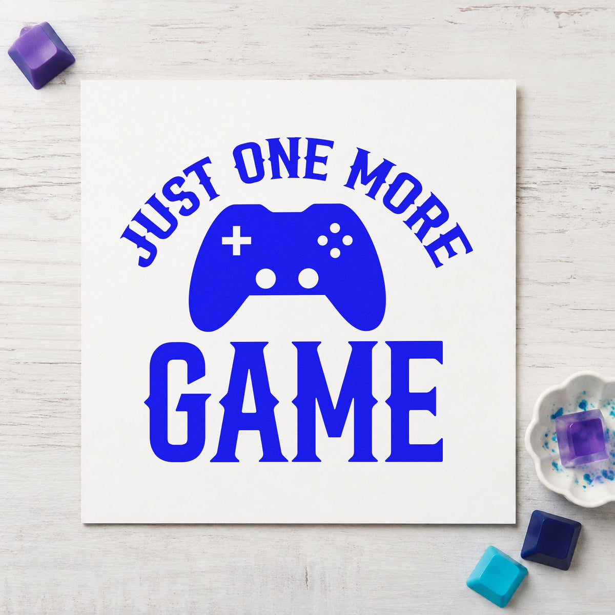 Just One More Game craft stamp imprinted in blue ink on paper, a design suited to framed landing shelf.