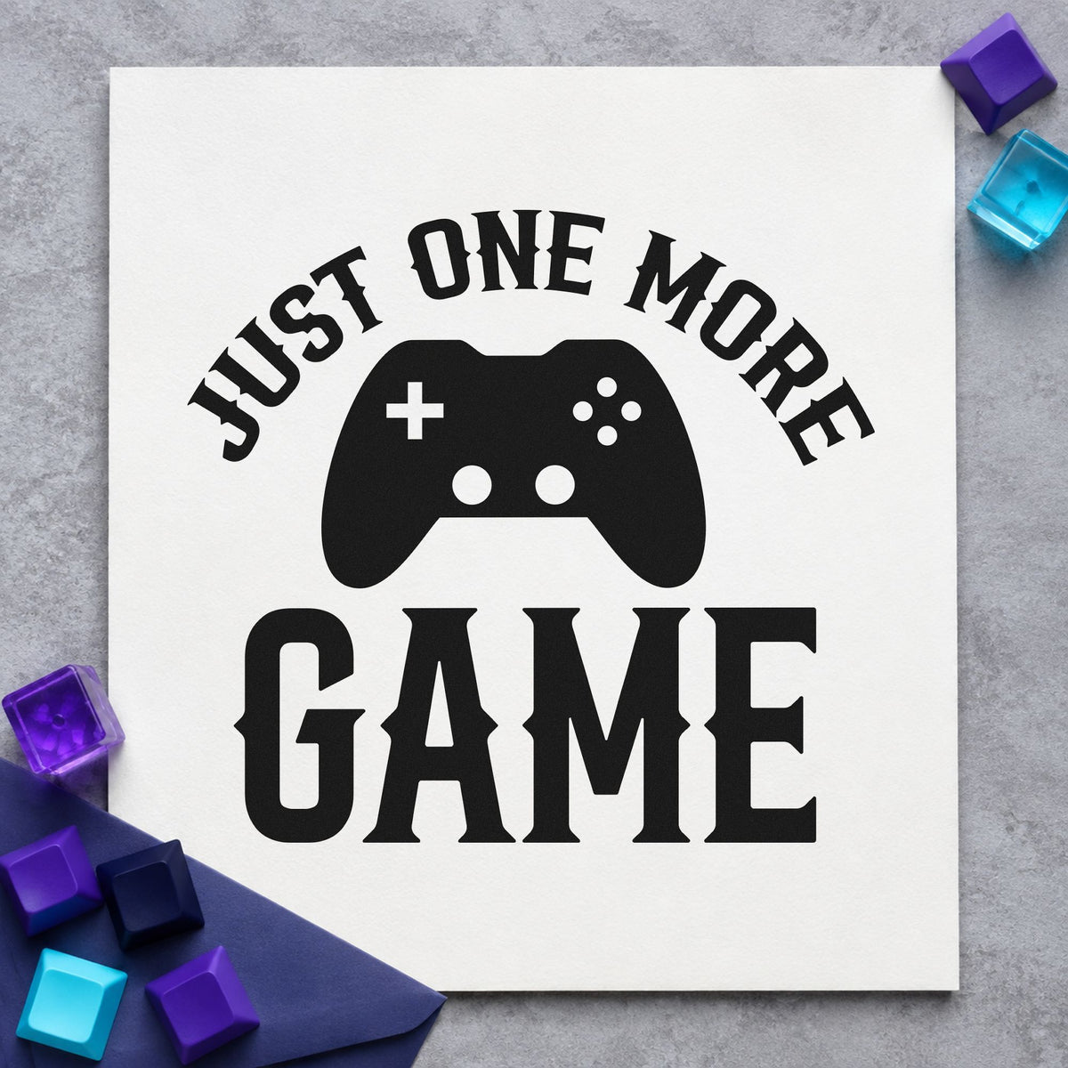 Just One More Game rubber stamp printed in black ink, ready for small controller cards and similar paper crafts.