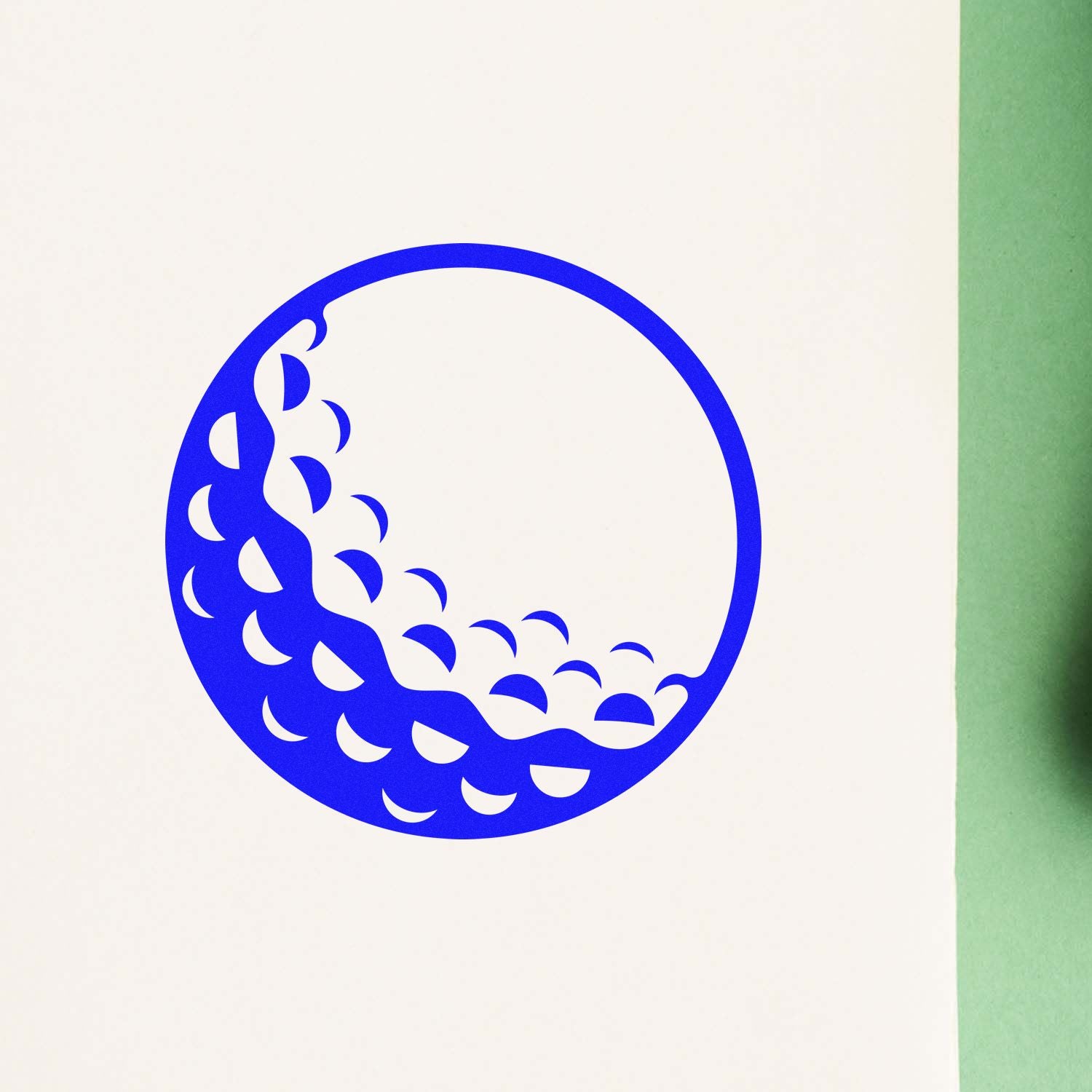 Custom rubber stamp impression with blue circular wave design for branding, packaging, and stationery.