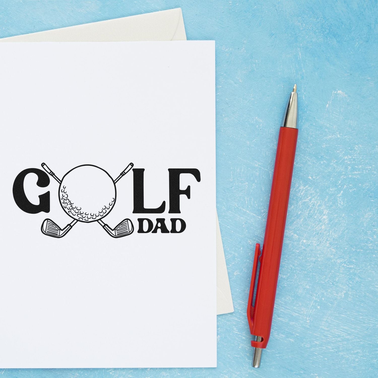 Golf Dad rubber stamp on greeting card with pen, perfect for personalized Fathers Day cards and golf-themed stationery.
