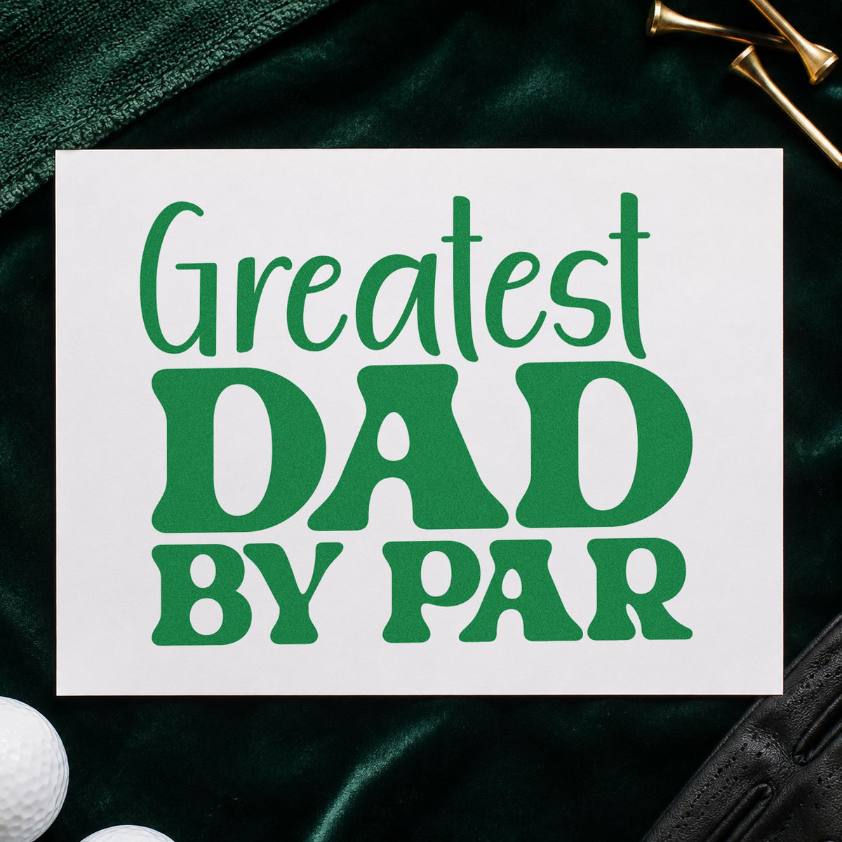 Greatest Dad By Par craft stamp imprint in green ink on a handmade project, one idea being story note cards.