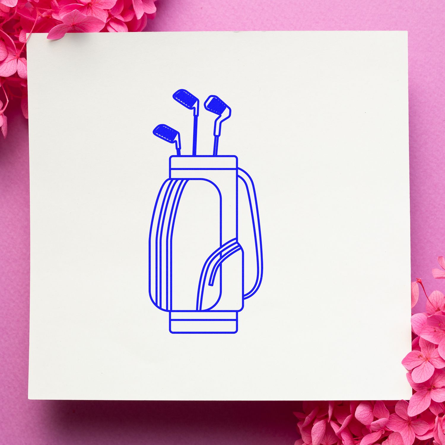 Golf bag rubber stamp design with clubs, blue line art on white card for golf-themed crafting and stationery.