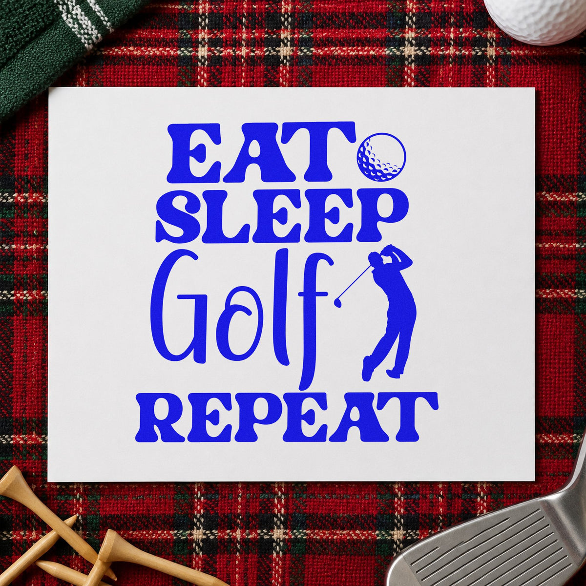 Eat Sleep Golf Repeat craft stamp imprinted in blue ink on paper, a design suited to framed camp shelter.