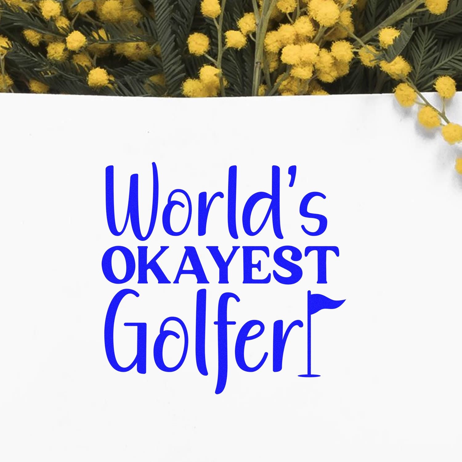 Worlds Okayest Golfer rubber stamp design in blue lettering with floral accent on white background.