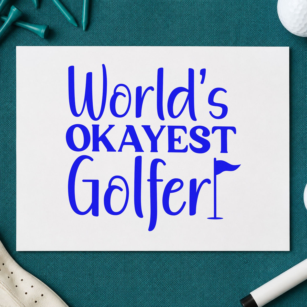 Worlds Okayest Golfer Quote craft stamp imprinted in blue ink on paper, a design suited to framed shed wall.
