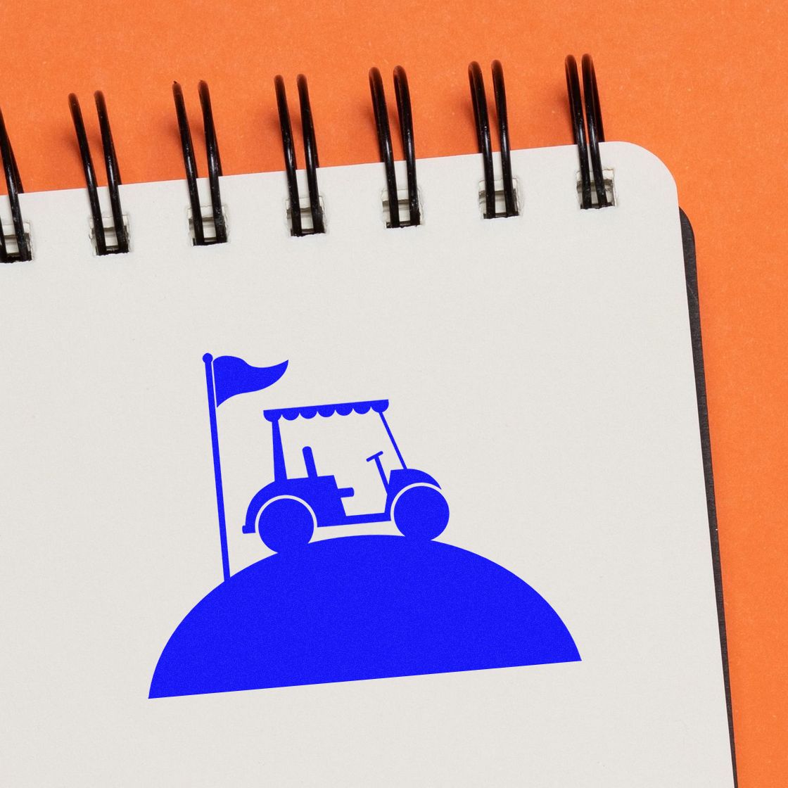 Golf cart rubber stamp design with flag on notebook page, ideal for golf course branding, event materials, and custom stamps.