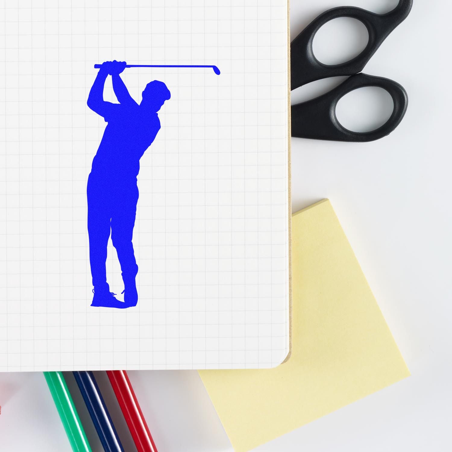 Golf swing silhouette custom rubber stamp impression on notebook paper, perfect for golf-themed branding and stationery.