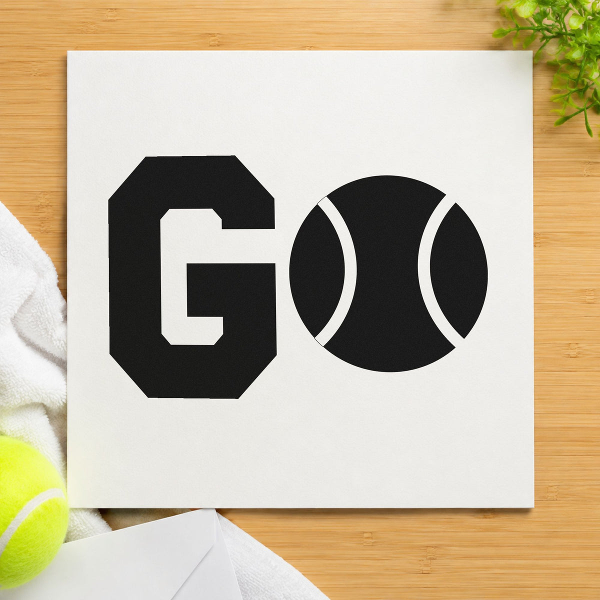 Go Tennis Ball Letter craft stamp imprint in black ink on a handmade project, one idea being team kit gift tags.